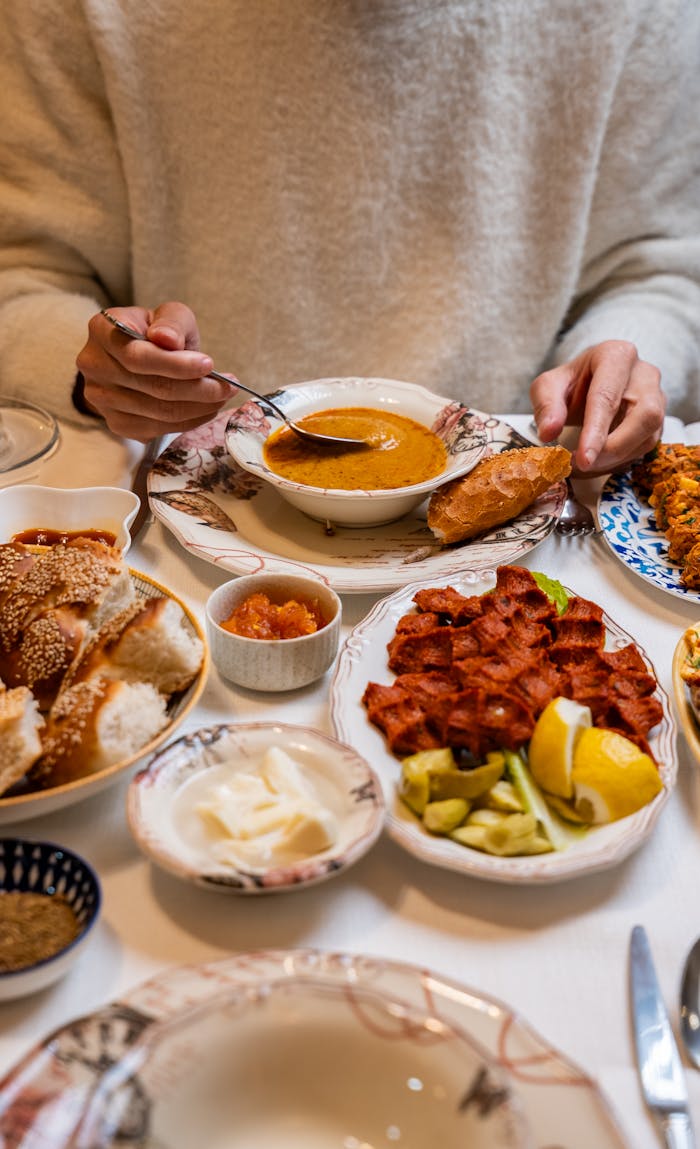 Delicious Turkish meal with soup, bread, and appetizers in Gaziantep.